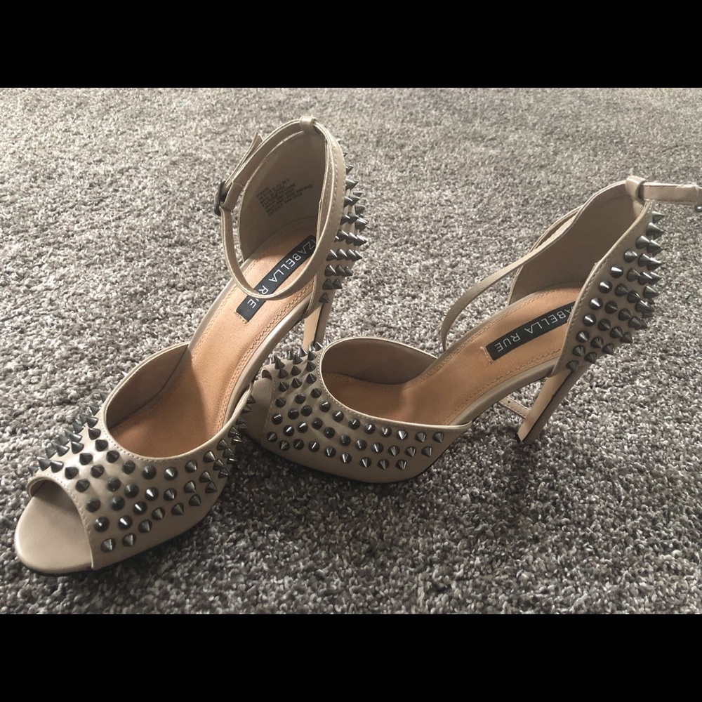 Tan heels with studs and open toe. Size 7.5